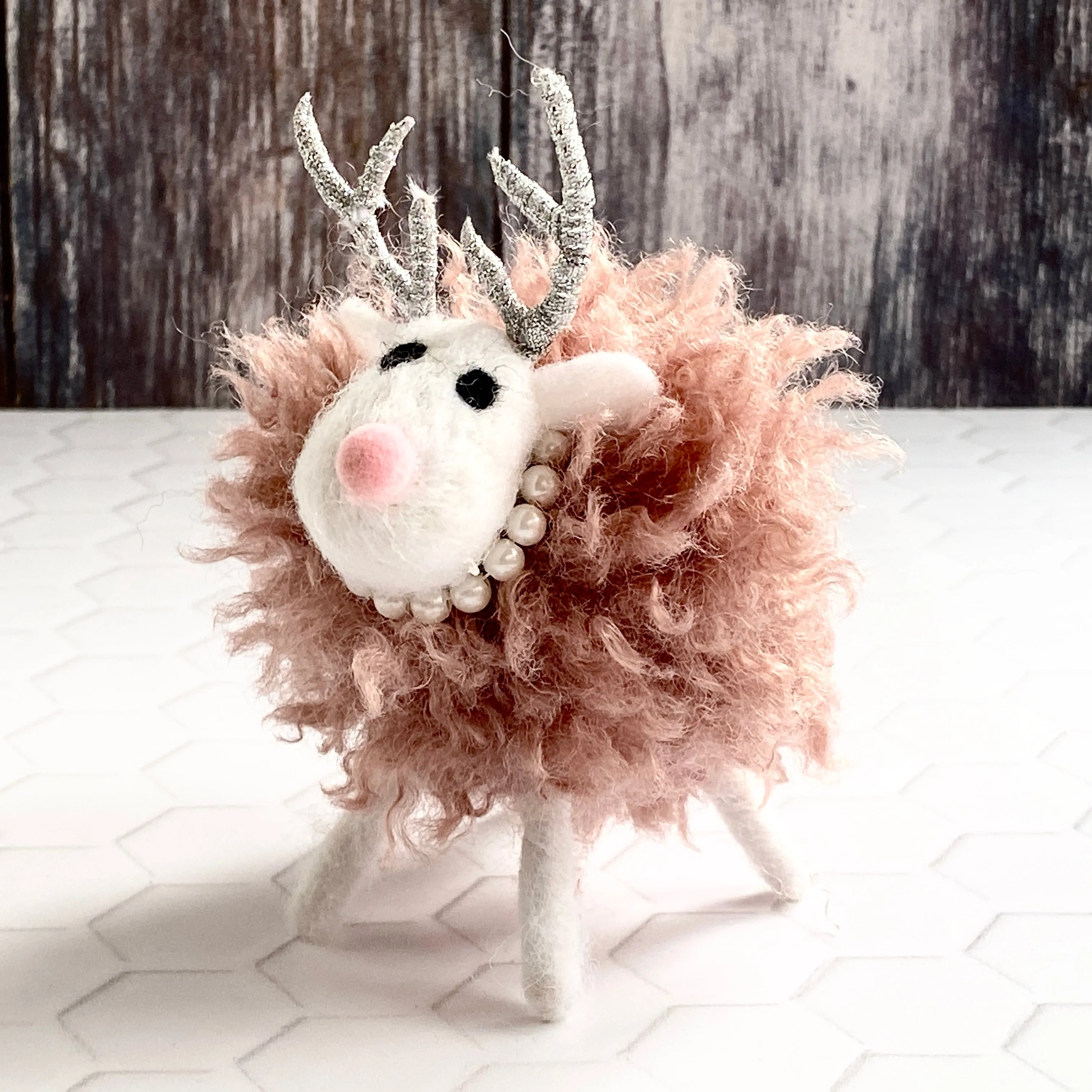 Pink Fluffy Reindeer with a Pearl Necklace