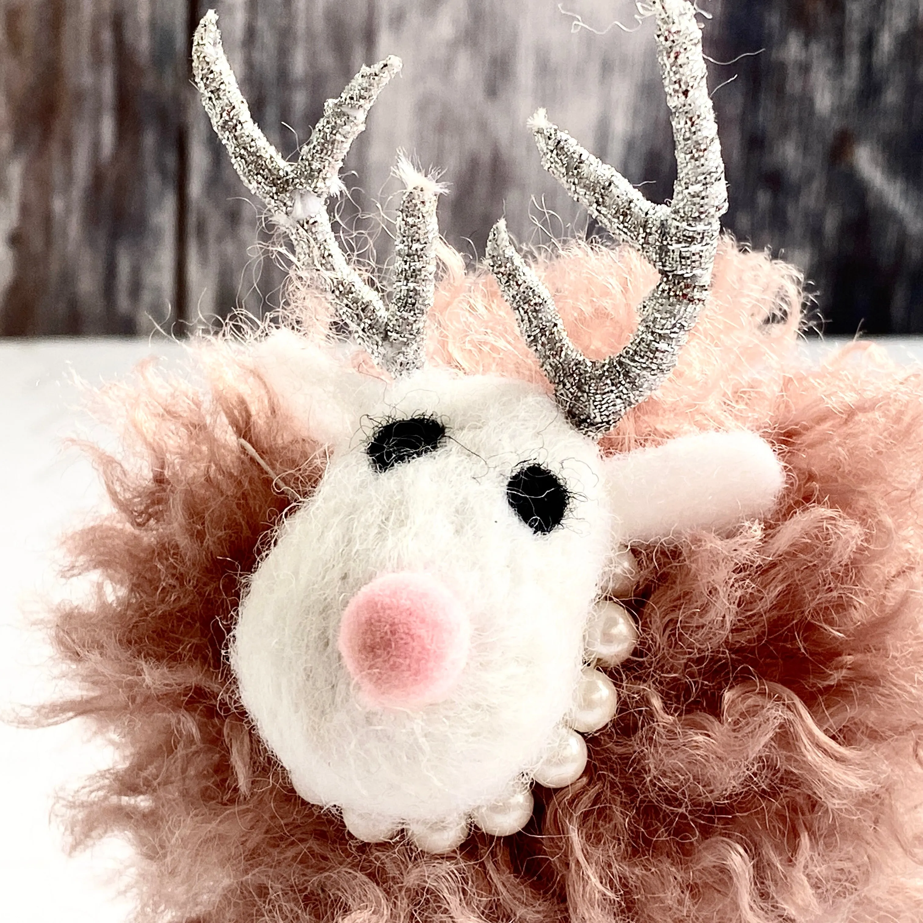 Pink Fluffy Reindeer with a Pearl Necklace